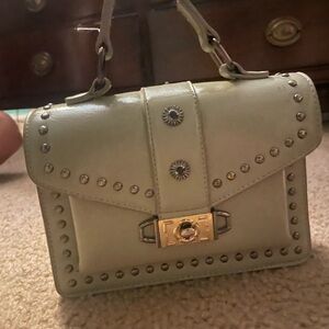Green, mini bag. good condition. very cute’